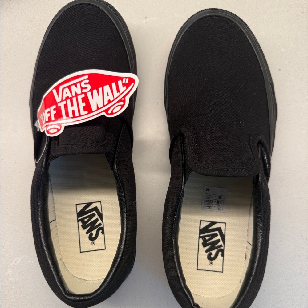 Vans Black Canvas Slip-Ons